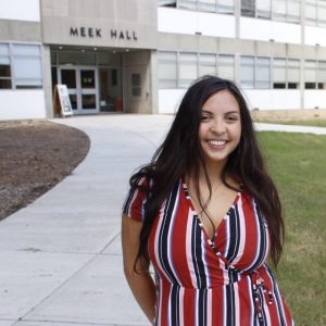 Rosa Salas standing in front of Meek Hall