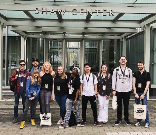 Graphic design students gathered together outside the conference center