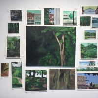 Photo of multiple paintings of landscapes.