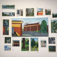 Photo of multiple paintings of landscapes.