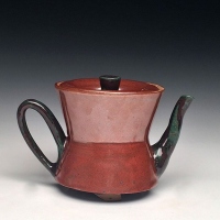 A ceramic tea kettle.