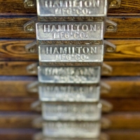 Repeated picture of a metal plate that says Hamilton on it.
