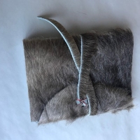 Photo of a fur book case on a table.